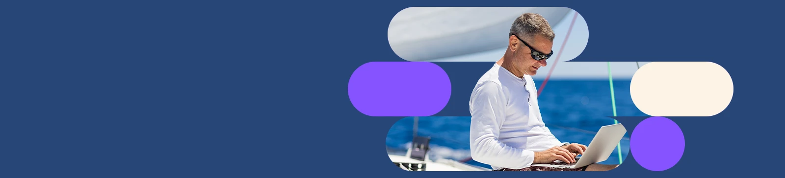 Homem a usar um computador portátil num barco